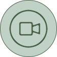 A green circle with a video camera in the middle.